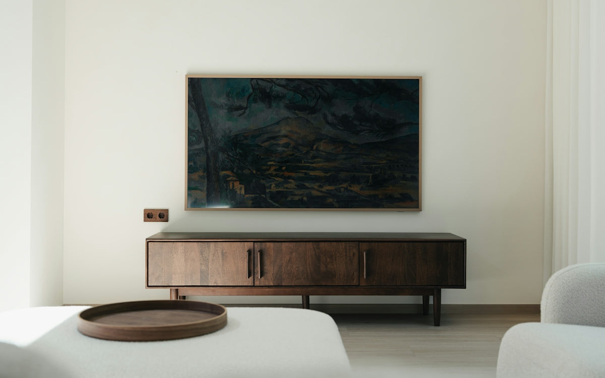 Modern living room with wooden credenza and abstract art