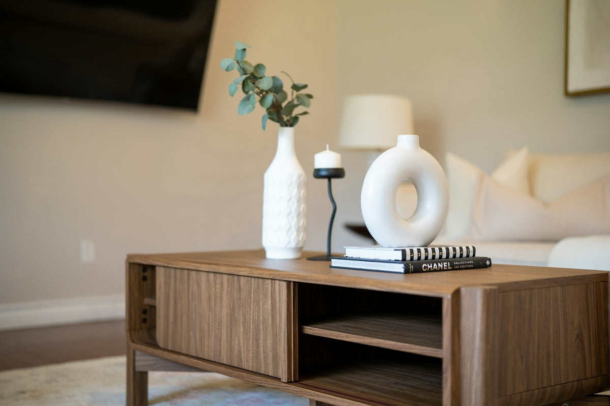 Decorated coffee table with vases and books